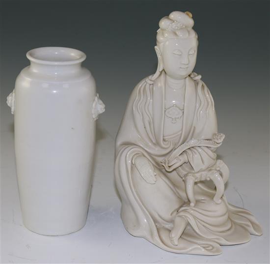 A Chinese Dehua blanc-de-chine seated figure of Guanyin and a similar vase, 17th/18th century,